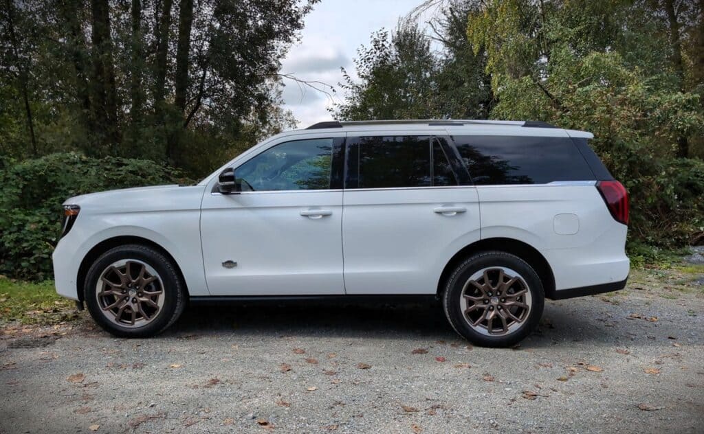 2025 Ford Expedition King Ranch Review 3 White SUV with black tinted windows and stylish alloy wheels, ideal for outdoor adventures and family travel.