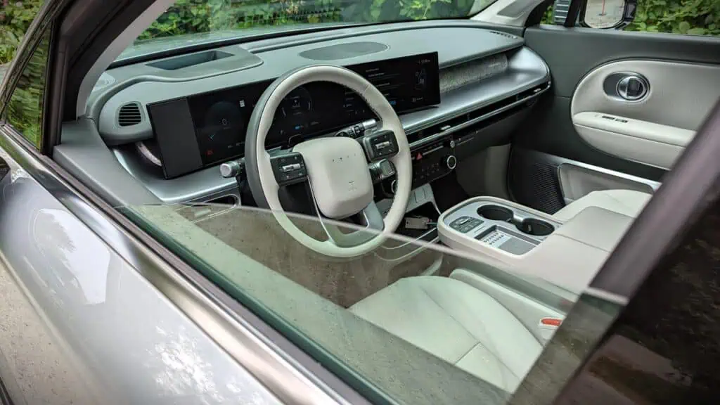 2026 Hyundai Ioniq 9 Preferred Ultimate Calligraphy Review 11 Interior of a futuristic electric vehicle with digital displays and minimalist aesthetic.