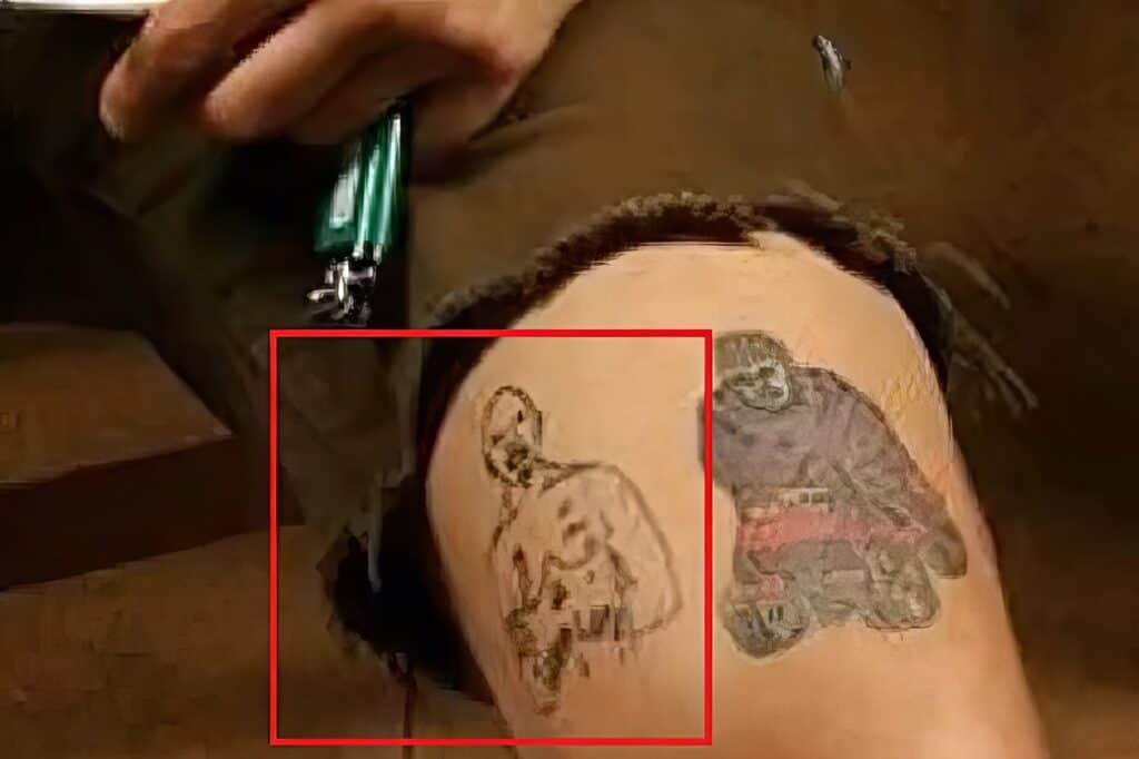 Close-up image of a tattoo featuring an artistic depiction of a playboy bunny on an individual's arm, with intricate shading and line work.