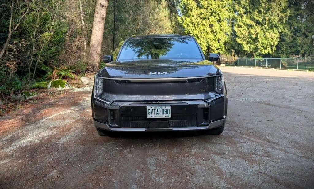 An image of the 2026 Kia EV9 GT showcasing its sleek, modern design with a bold front grille and distinctive LED headlights, emphasizing its advanced electric vehicle features.