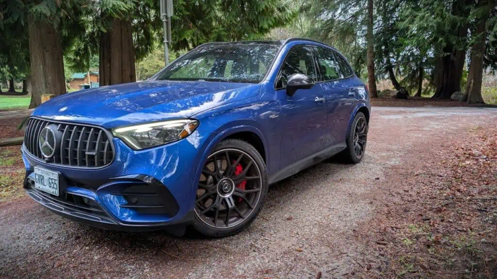 2026 Mercedes-AMG GLC 63 S E Performance Review 8 An image of the 2026 Mercedes-AMG GLC 63 S E Performance showcasing its sleek blue exterior, sporty design, and high-performance features, set against a natural outdoor background.