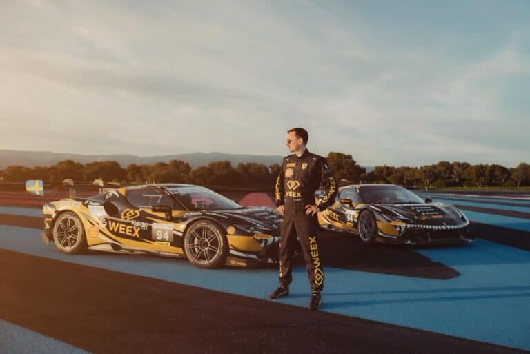 Carl Moon Runefelt standing between two high-performance Ferrari race cars during a racing event at Paul Ricard, showcasing luxury and speed in motorsport.