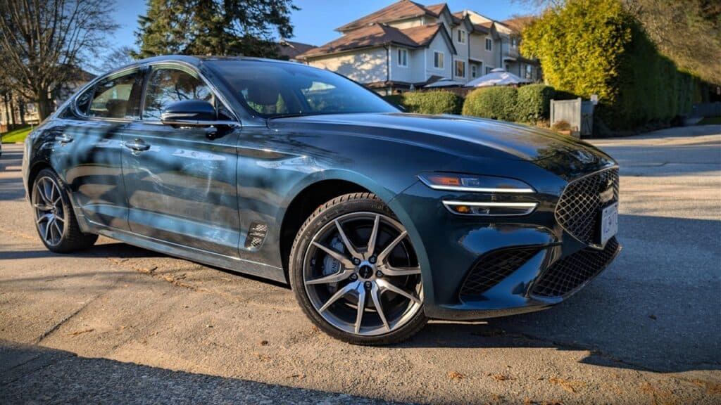 Luxurious 2026 Genesis G70 2.5T Prestige sedan parked outdoors.