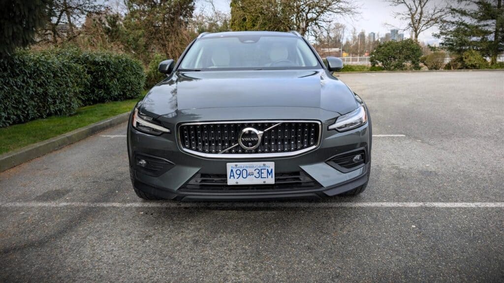 An image showcasing the front exterior of the 2026 Volvo V60 Cross Country B5, highlighting its sleek design, grille, and modern headlights.