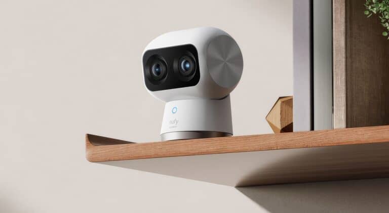 A robot security camera with dual lenses on a wooden shelf, designed for home surveillance and smart security systems.