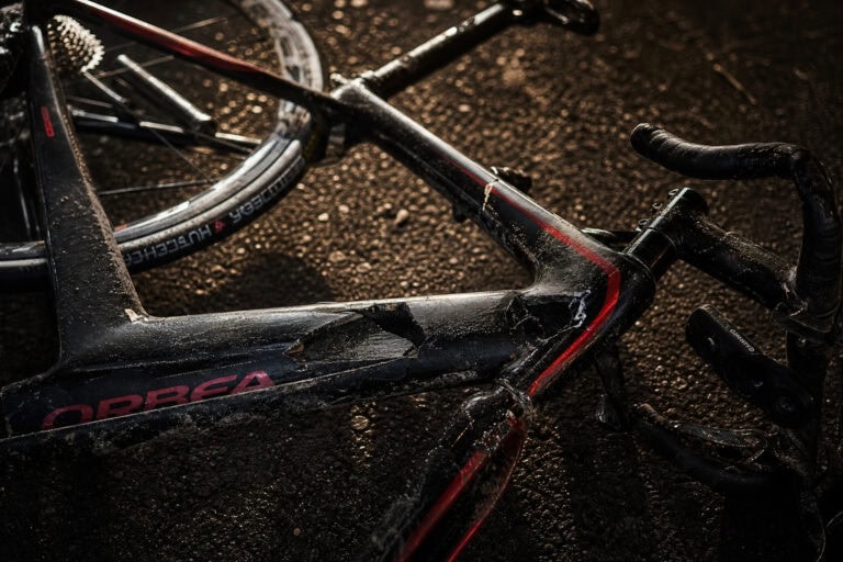 Bike accident, crash scene, and safety tips for cyclists to prevent legal issues after a collision.
