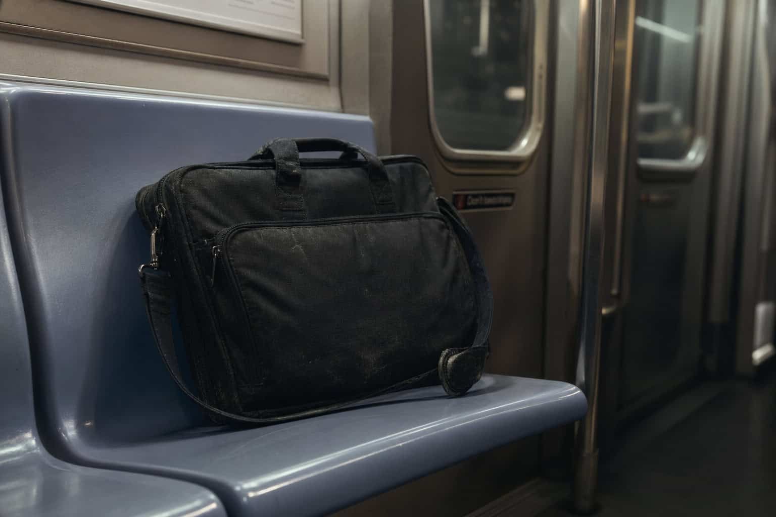 A mundane laptop bag used for discreetly carrying essential gear without attracting attention.