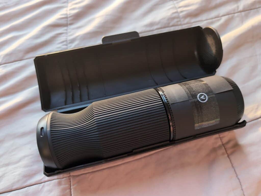 Unfinished Man review of Arcwave Orbit: sleek black rotating stroker device with protective case on a bed.