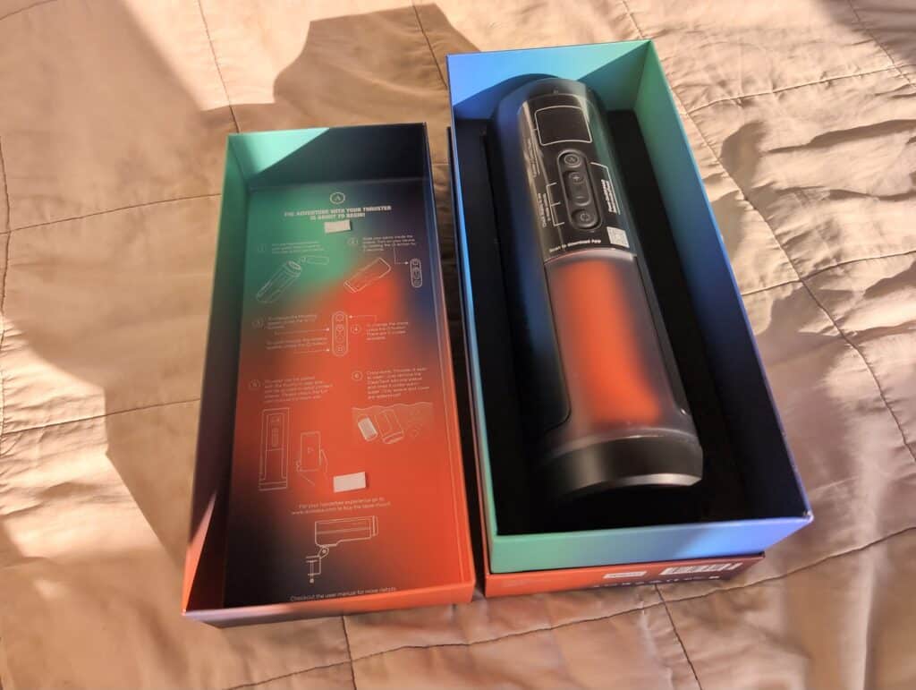 Unfinished Man review of Arcwave Thruster showing the device in its packaging on a bed.
