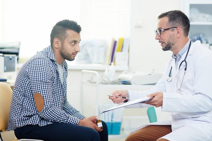 Man talking to doctor