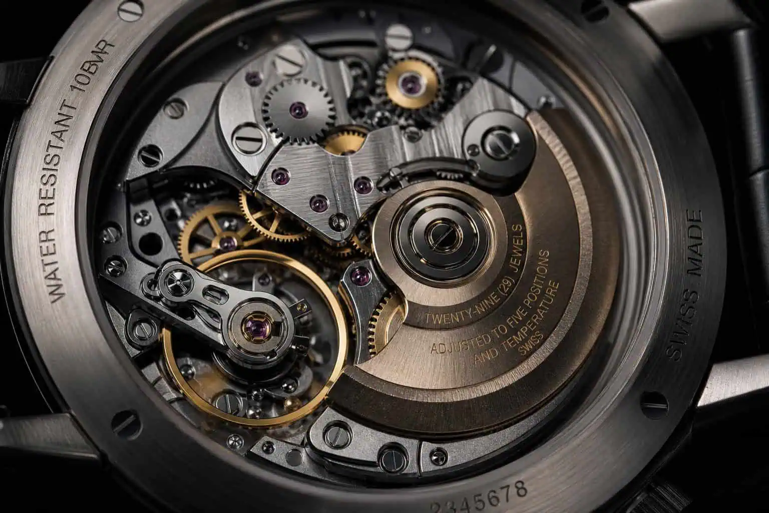 Open caseback revealing watch movement and serial numbers for authentication.