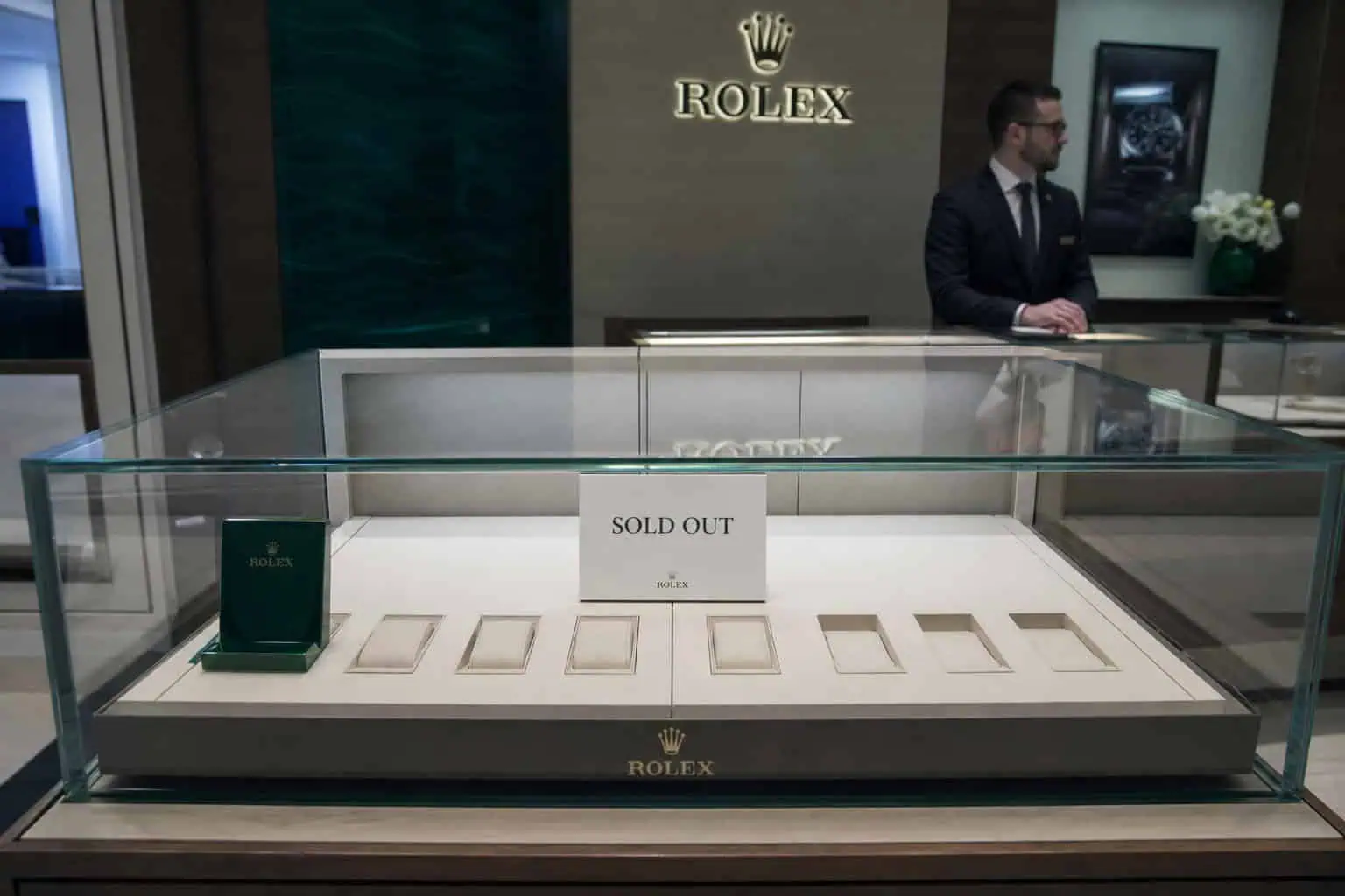 What Is a Poor Man's Rolex? The Real Answer (Tudor, Seiko, Omega) 8 Empty Rolex authorized dealer display case with sold out sign
