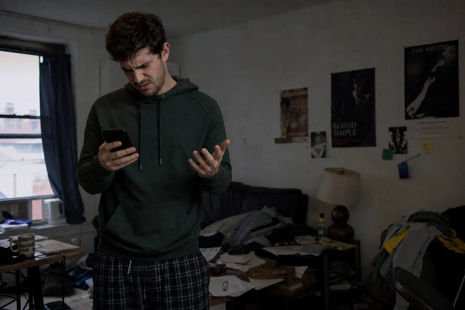 Goose Dating App Download: Why You Can't Get It Yet (56,000 Pre-Downloads) 2 Man looking frustrated while searching for Goose dating app on his phone.