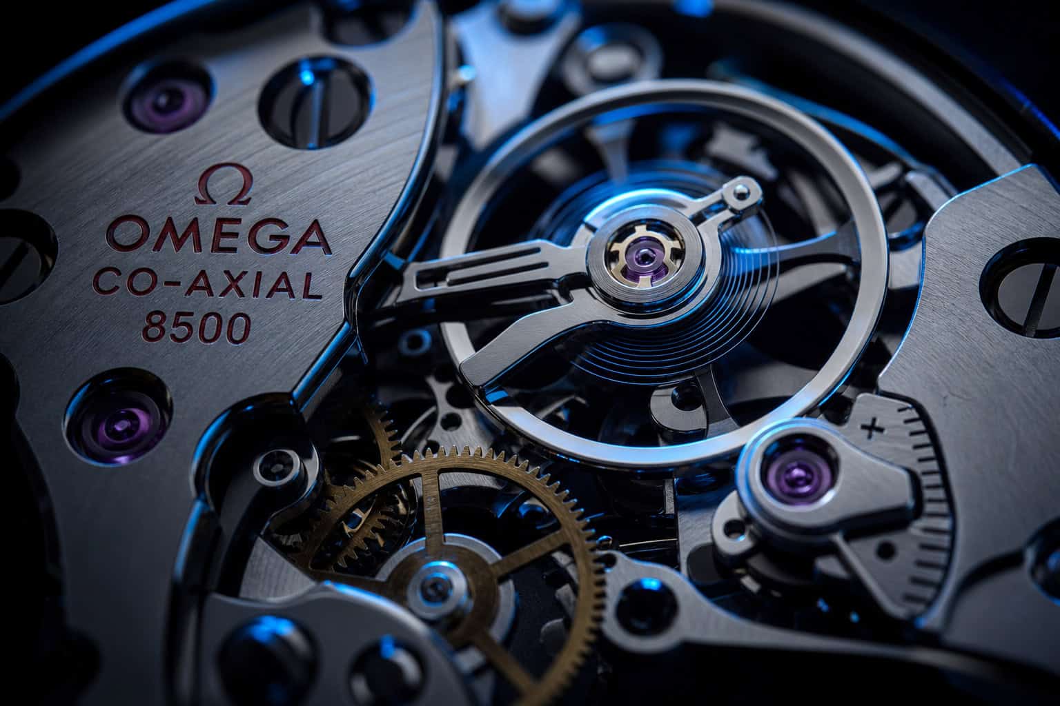 Omega vs Rolex Owners: Age, Income, and What Drives the Choice 4 Macro close-up of Omega Co-Axial escapement movement with blue lighting