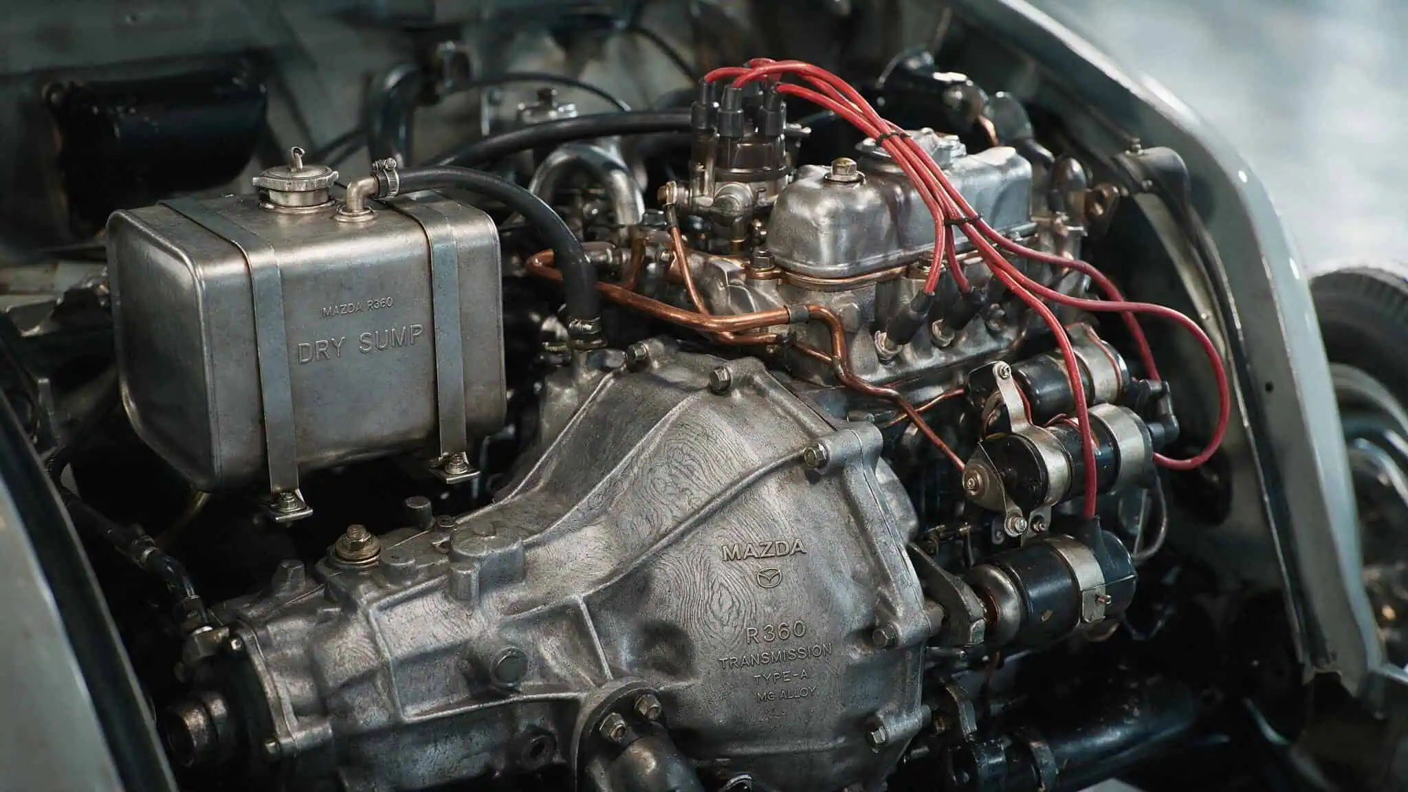 Mazda R360: The First Mazda Car and the Scrappy DNA That Built an Automaker 2 Mazda R360 engine bay with magnesium alloy parts and dry sump lubrication system.