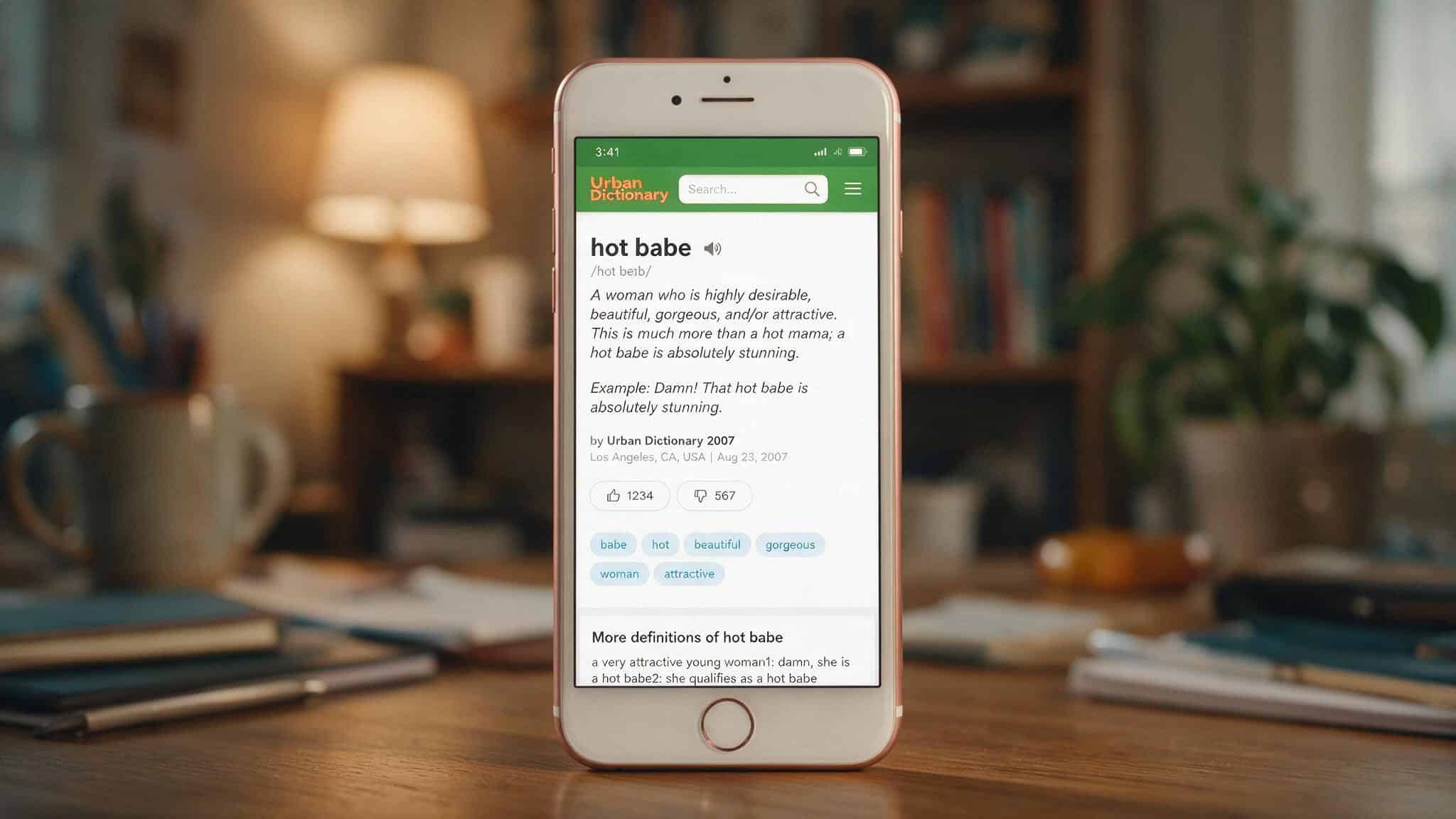 What Does 'Hot Babe' Mean? Definition, Usage, and When It Offends 2 Smartphone displaying Urban Dictionary definition of hot babe from 2007