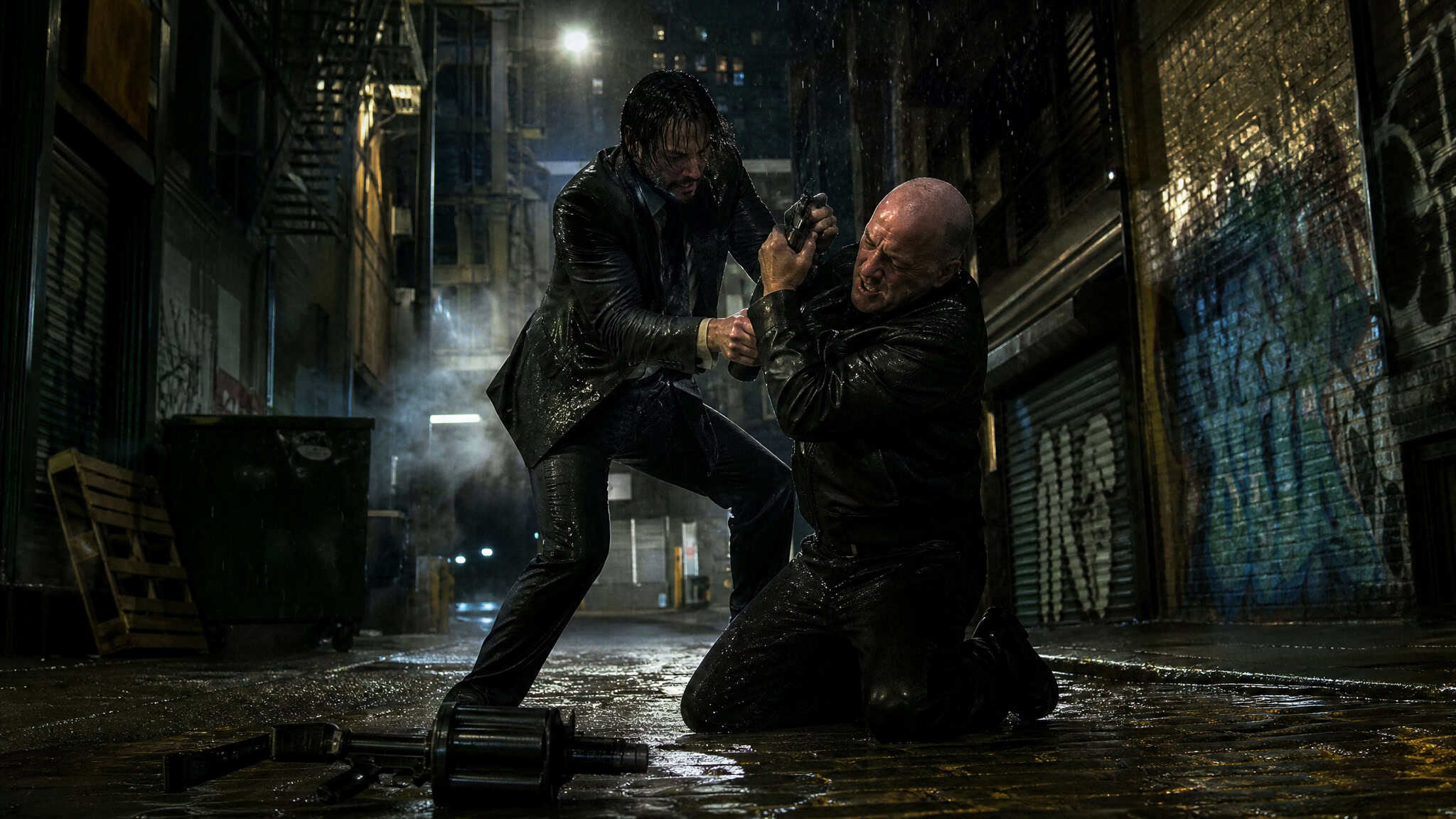 Jason Bourne vs John Wick: Who Wins in a Real Fight? 4 Bourne disarms Wick's pistol in a rainy alley fight