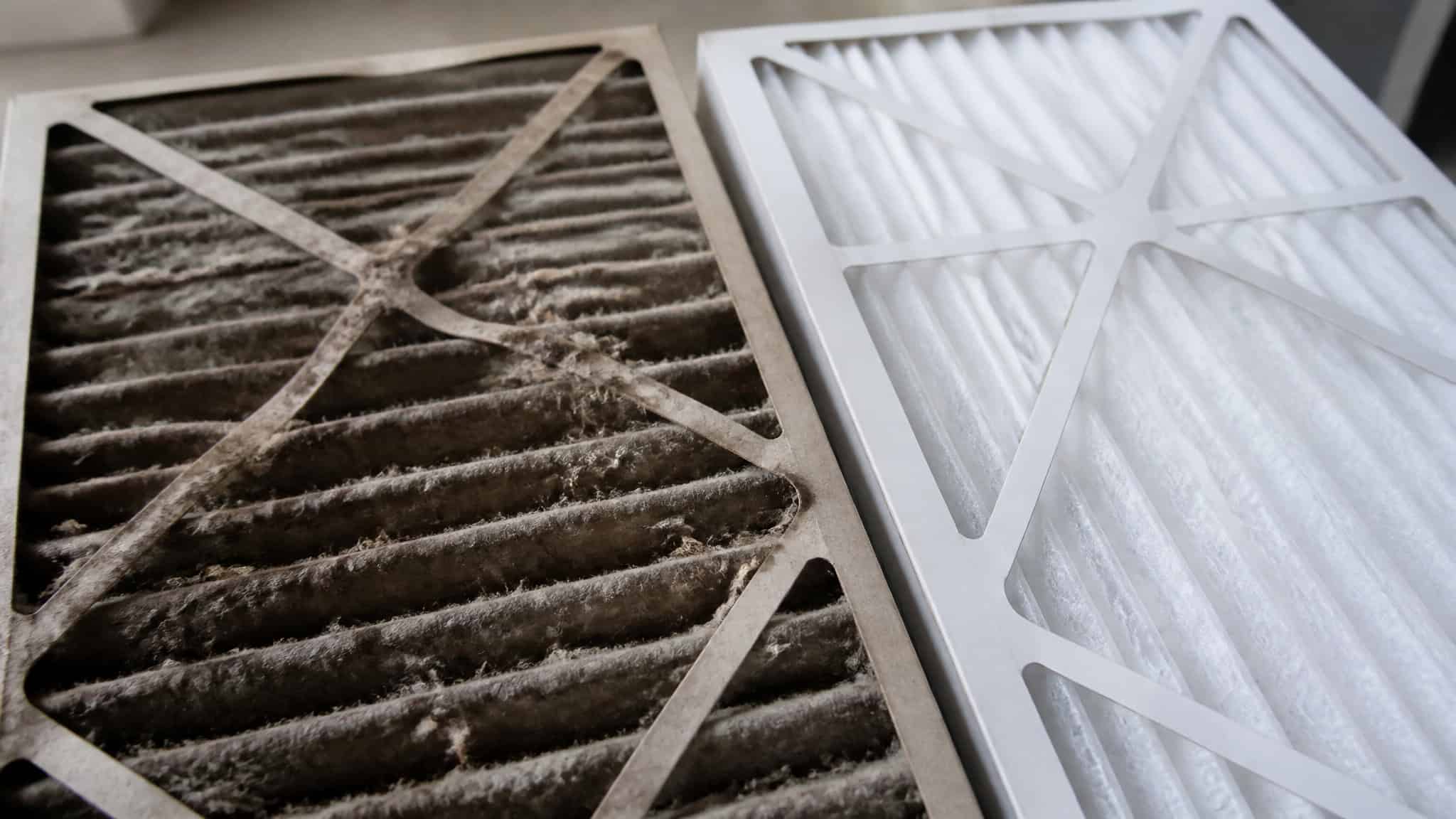 AC Ice on Coils? Don't Chip It. Here's What to Do (and What It Costs) 2 Dirty clogged HVAC air filter compared to a clean replacement filter