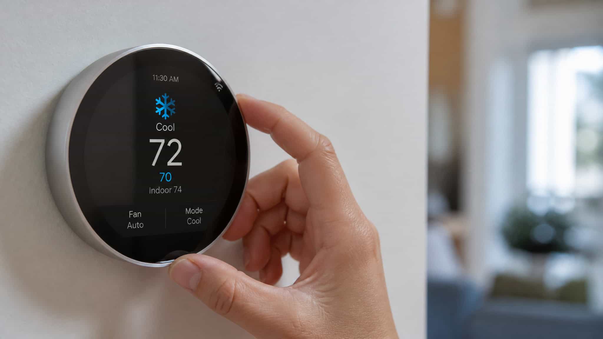 AC Not Cooling Enough? 5 DIY Checks Before You Call a Pro 3 Hand setting a smart thermostat to cool and auto fan mode