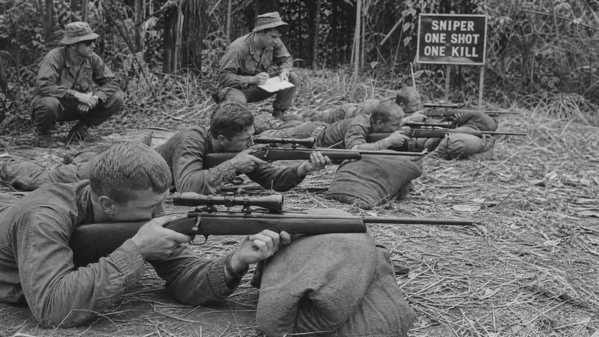 How to Become an Army Sniper: The 7-Week Course and Drone-Era Training 2 Vietnam War-era sniper training class with scoped rifles, showing the origins of Army sniper school.