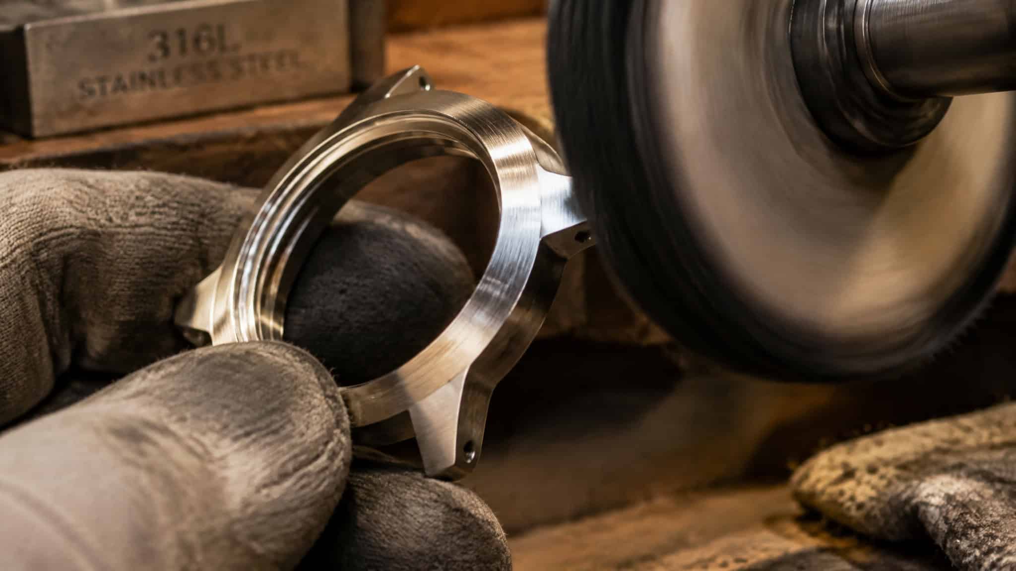 Stainless Steel Watch vs Other Watch Metals: Why Ceramic Wins on Value 2 Finishing a 316L stainless steel watch case, showing why steel polishes and finishes any way you want