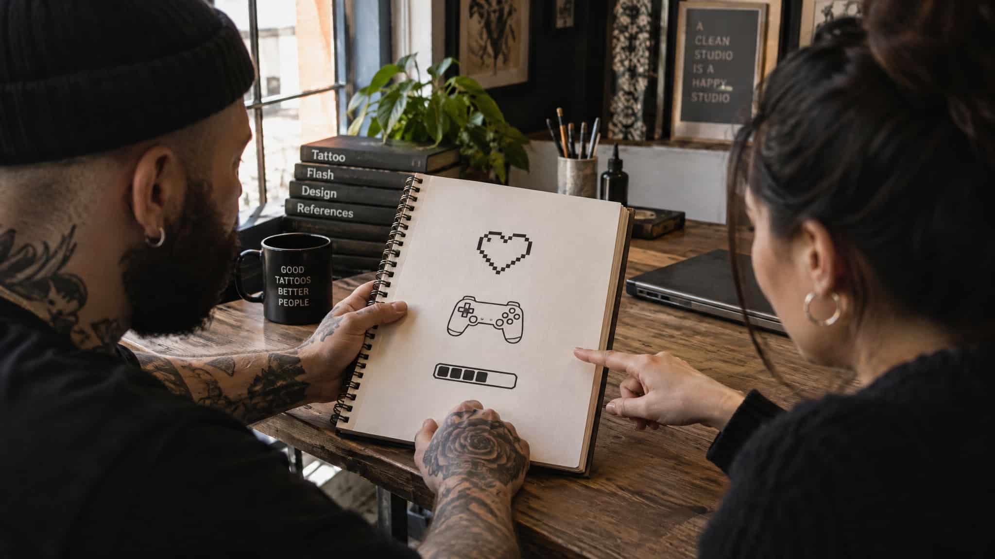 Icon-level gamer couple tattoo designs like pixel heart and controller outline sketched before committing