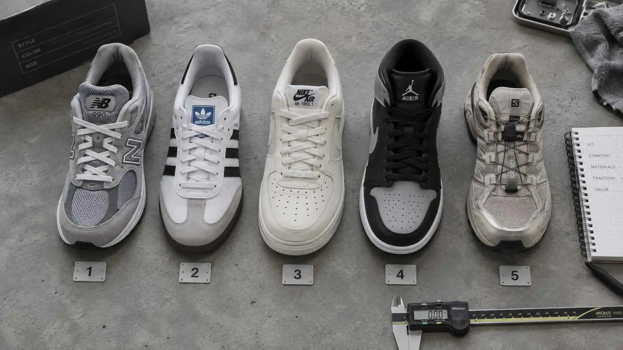Sneakers That Make You Taller: 7 Lab-Tested Picks Ranked by Measured Stack Height 2 A lineup of five different sneaker models from brands like New Balance, Adidas, Nike, Jordan, and Bape, showcasing various styles and designs.