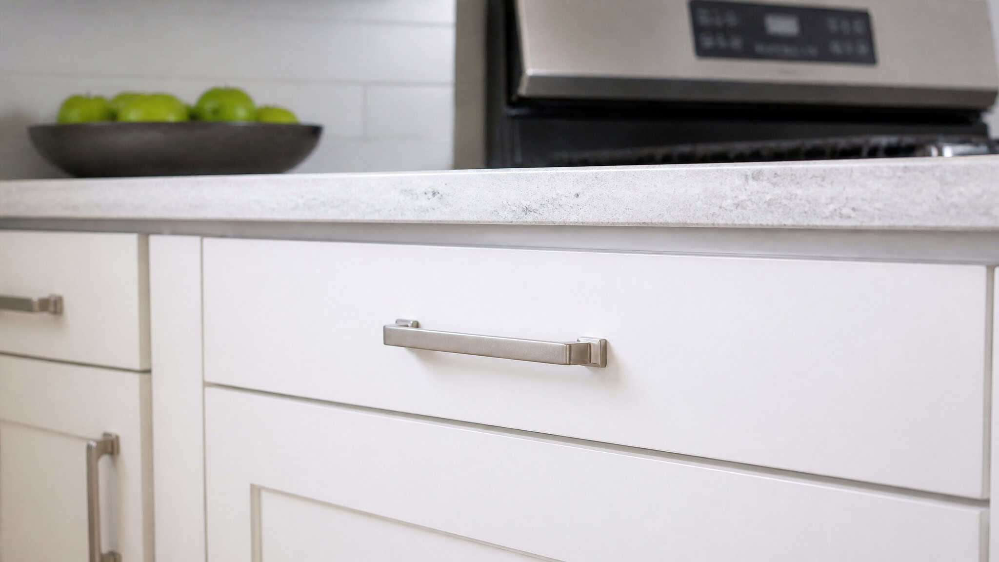 Cheap Upgrades to Increase Home Value: 268% ROI on a Garage Door 4 White shaker cabinet with brushed nickel pull in a modern kitchen