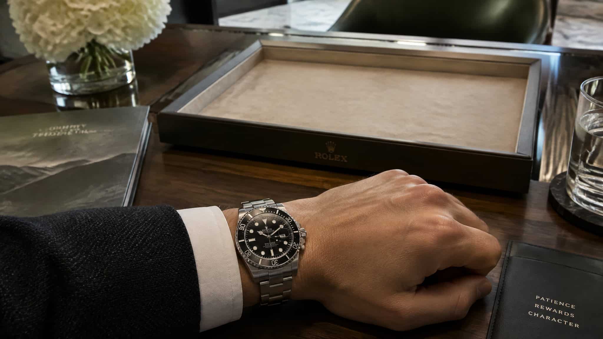 Rolex stainless steel Submariner on wrist illustrating retail scarcity and the single-watch buying answer