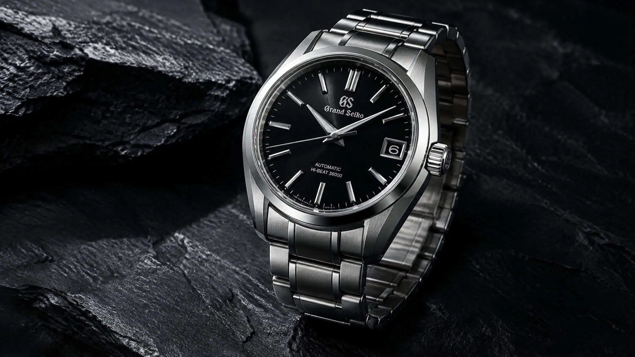 Stainless steel watch case representing the default watch metal compared across materials