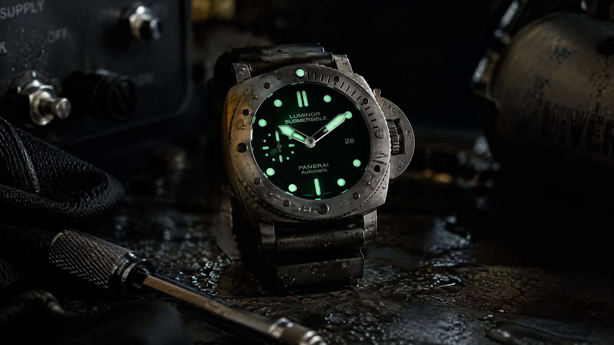 Steel dive watch with glowing lume dial demonstrating why a unidirectional bezel defines a real dive watch