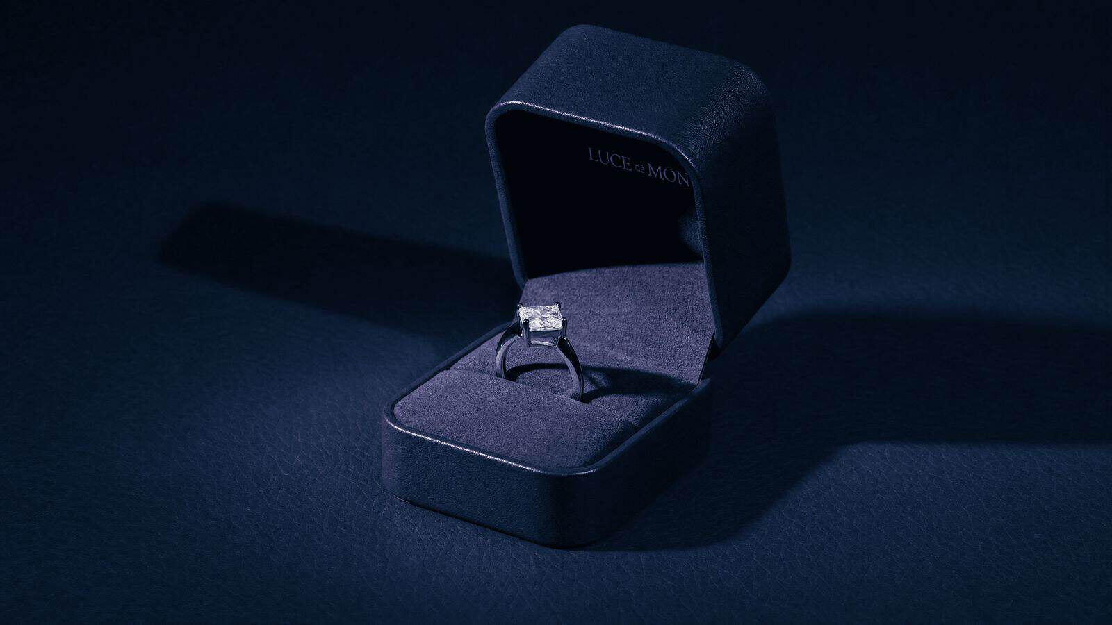 Elegant diamond engagement ring in a black velvet box, perfect for a memorable proposal.