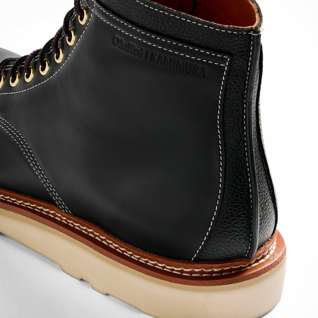 OluKai x Neil Kamimura Limited Edition 'Pāhi' Boots: Price, Release Date, and the Bladesmith Behind the Drop 6 Close-up of OluKai x Neil Kamimura 'Pāhi' boots showcasing premium black leather, gold eyelets, and detailed stitching for a stylish, limited edition footwear.