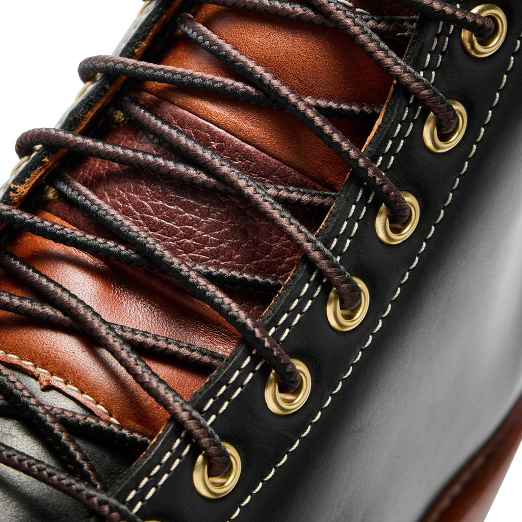 OluKai x Neil Kamimura Limited Edition 'Pāhi' Boots: Price, Release Date, and the Bladesmith Behind the Drop 7 Close-up of OluKai x Neil Kamimura 'Pāhi' boots showcasing premium leather, detailed stitching, and gold eyelets for a stylish, durable design.