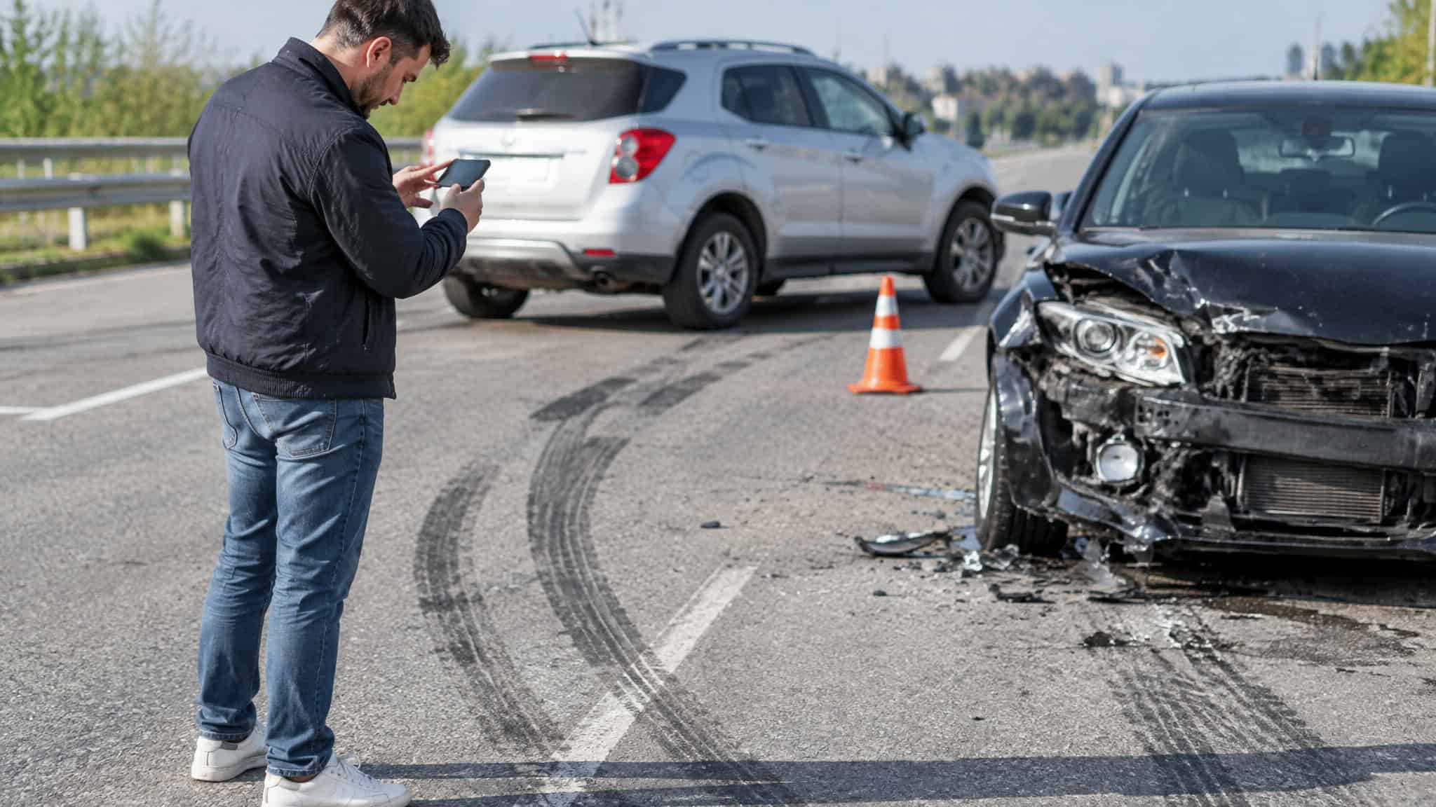 What to Do After a Truck Accident: Protect Your Health & Claim 2 Documenting the truck accident scene with photos and notes.