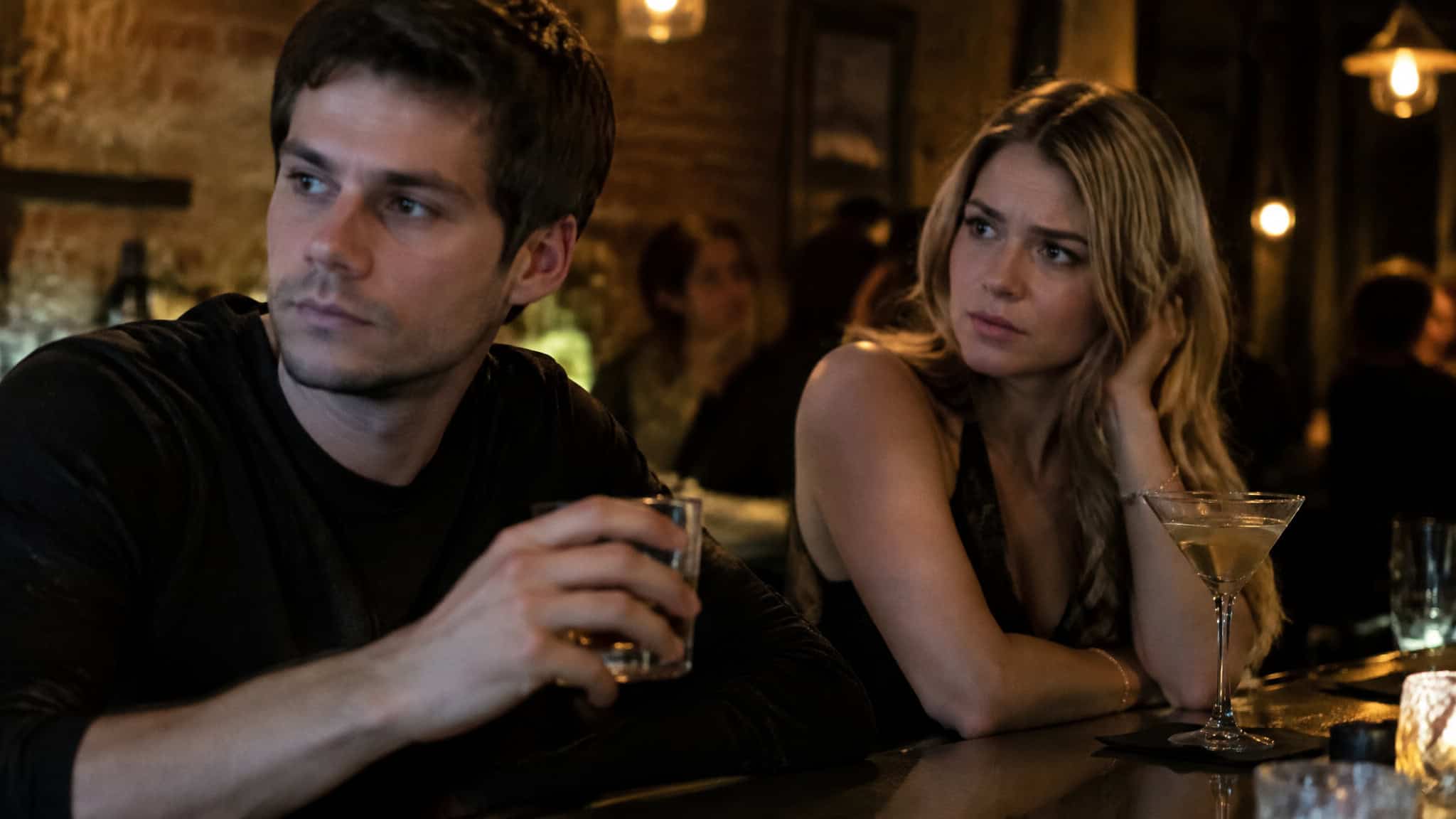 Couple with tension at a bar, representing measured loss of respect after casual sex in college studies