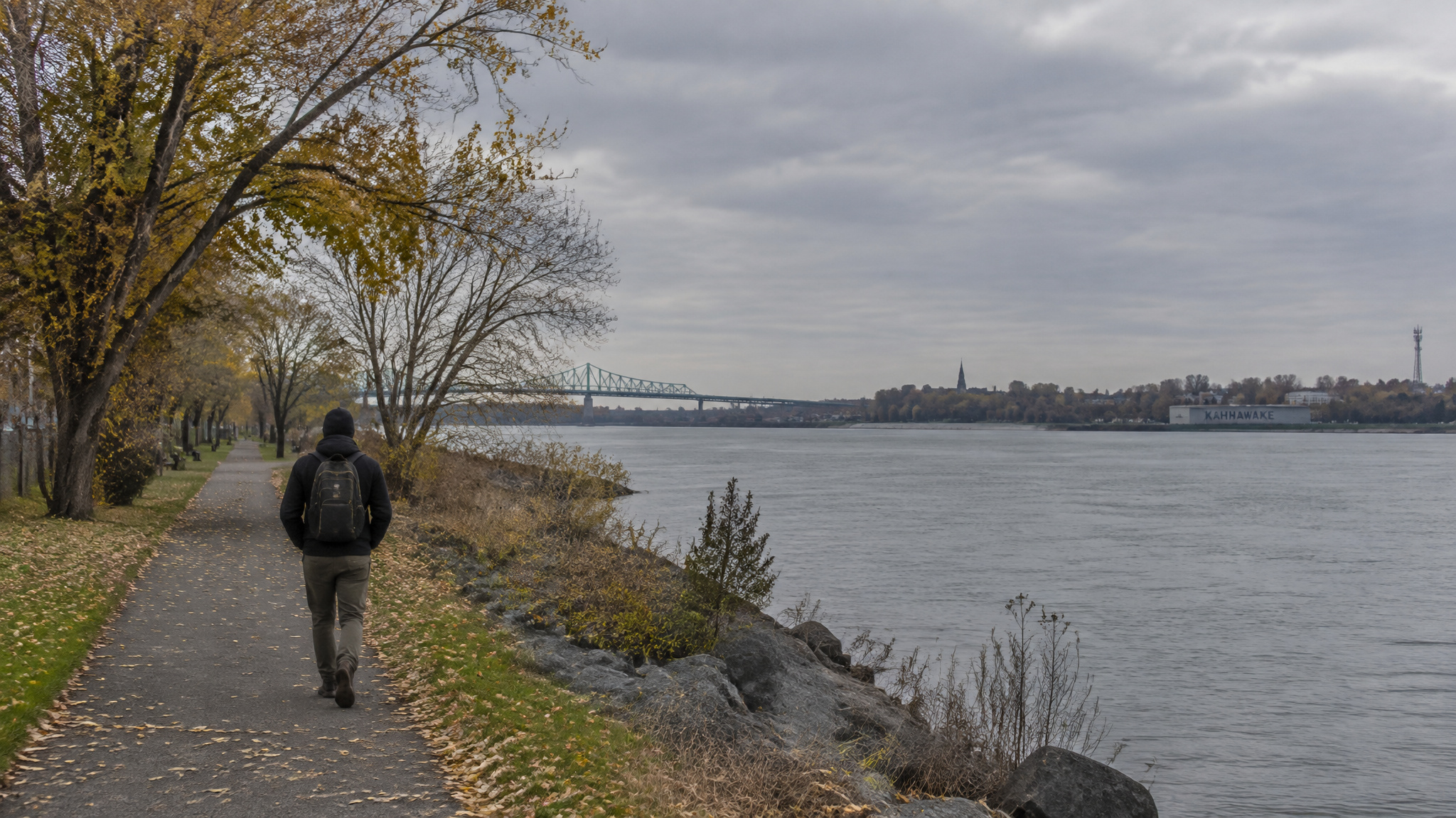 Riverside walking path from Sainte-Catherine toward Kahnawake Mohawk territory near Montreal
